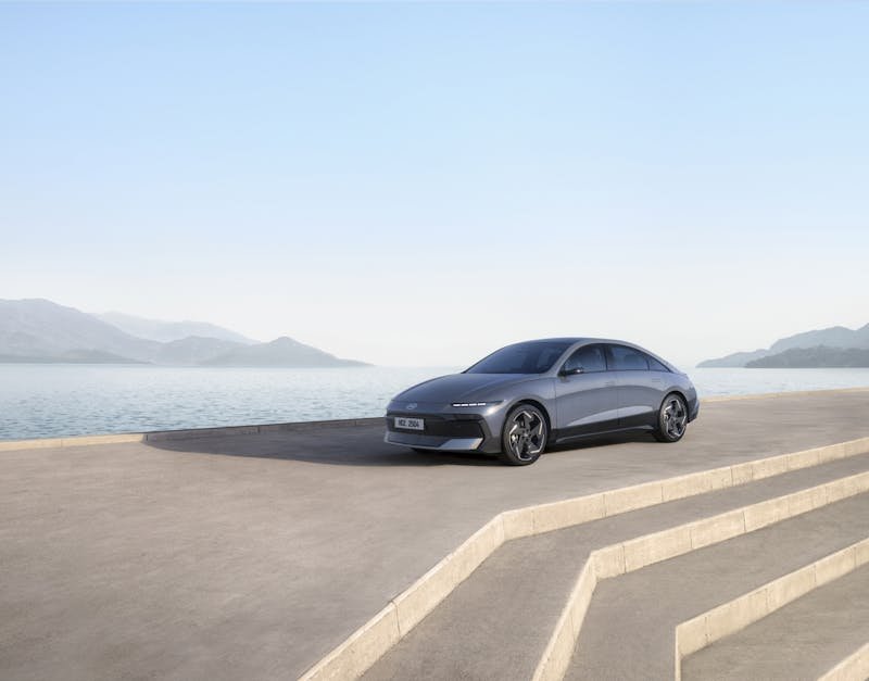 Hyundai IONIQ 6 parked with the sea in the background.