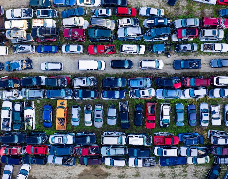 High angle shot of a junkyard filled with parked vehicles in Red Wing, Minnesota.